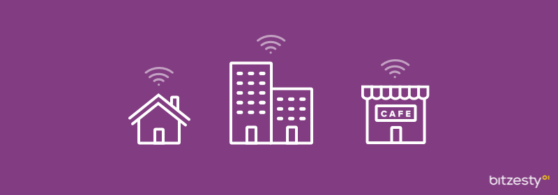 A series of icons representing home-working through a Wi-Fi symbol above a house, block of flats and cafe. 